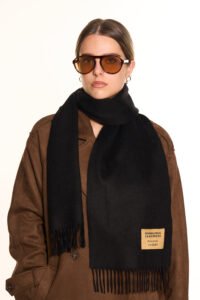 A folded plaid cashmere scarf in a high-quality gift box.