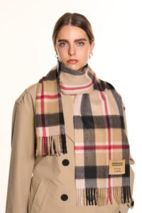 A cream-colored cashmere scarf in a stylish premium box.