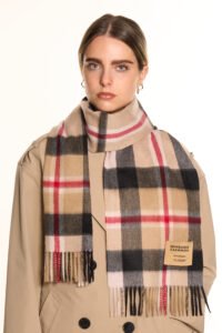 Gift-wrapped cashmere scarf next to a handwritten Valentine’s card