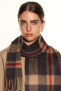 A folded tartan cashmere scarf in a signature Scottish gift box.