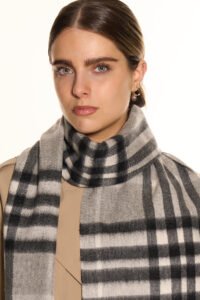A close-up of a premium cashmere weave, showcasing the vibrant dyes used for festival-themed scarves.