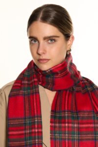 A romantic Valentine’s Day display of pure Scottish cashmere scarves in soft red and ivory tones, styled elegantly with gift boxes