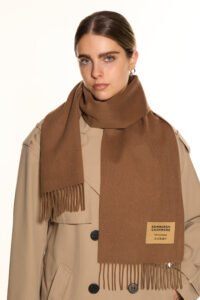 A luxury boutique display featuring the Lunar New Year collection of cashmere scarves.