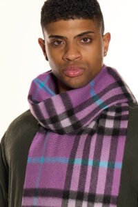 People of different cultures sharing gifts and wearing iconic Scottish cashmere scarves.