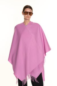 A group of friends draped in vibrant Edinburgh Cashmere capes and scarves.