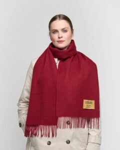 A mother wearing a luxurious cashmere scarf, showing elegance and warmth.
