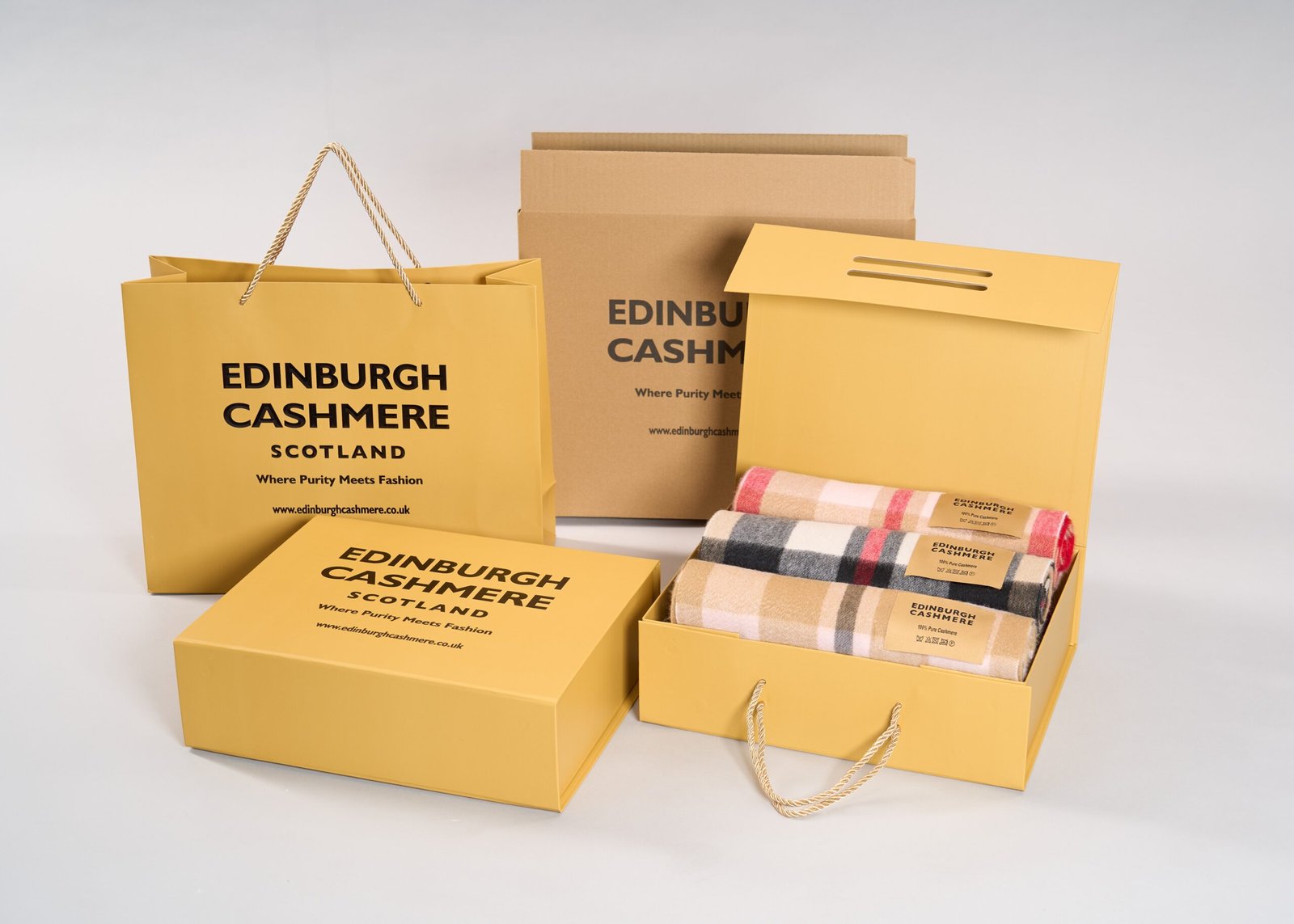 Edinburgh Cashmere branded bag alongside the scarf inside